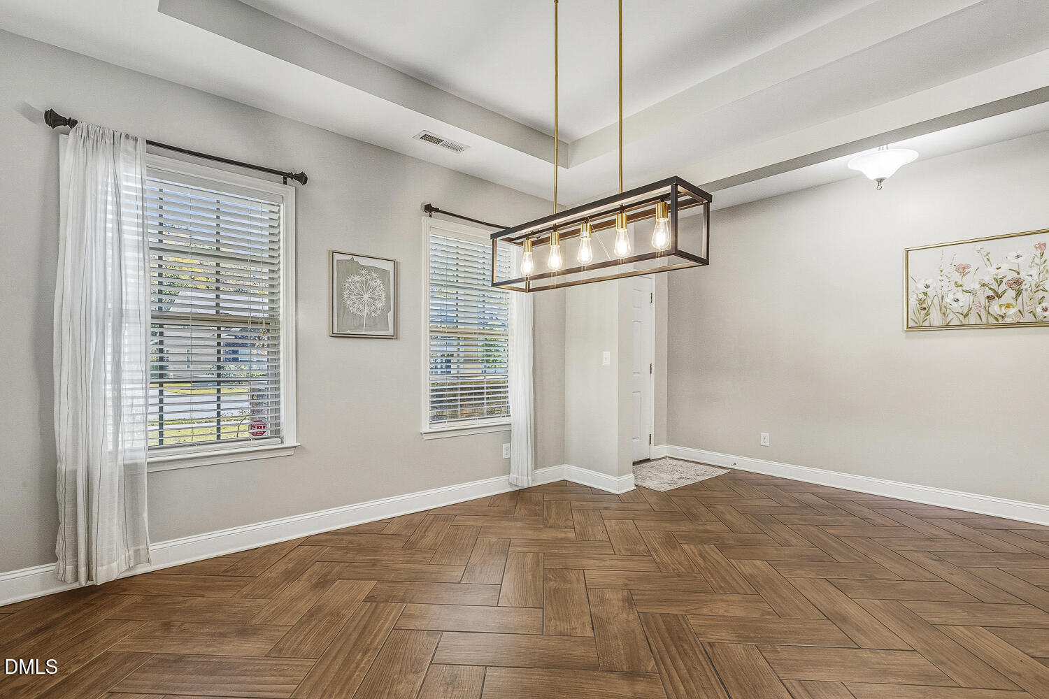 1008 Poplar Street Durham, NC 27703 - Photo 13 of 73 a view of empty room with wooden floor and fan