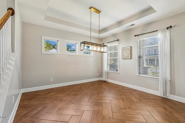 a kitchen with stainless steel appliances granite countertop a stove refrigerator sink and microwave