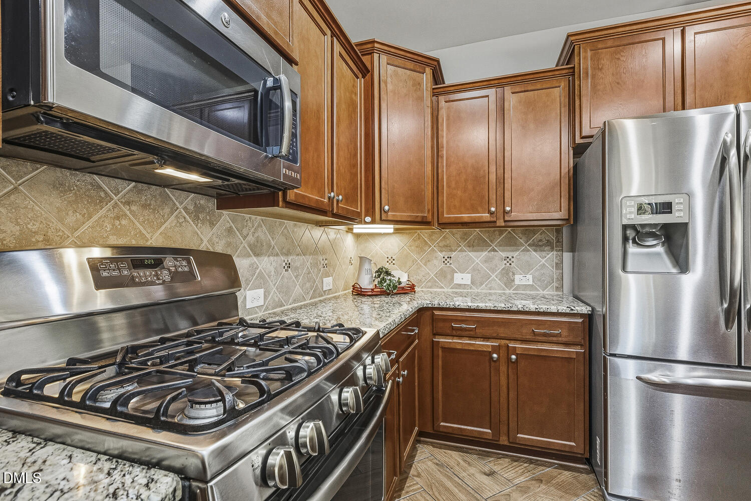 1008 Poplar Street Durham, NC 27703 - Photo 17 of 73 a kitchen with a stove and a refrigerator
