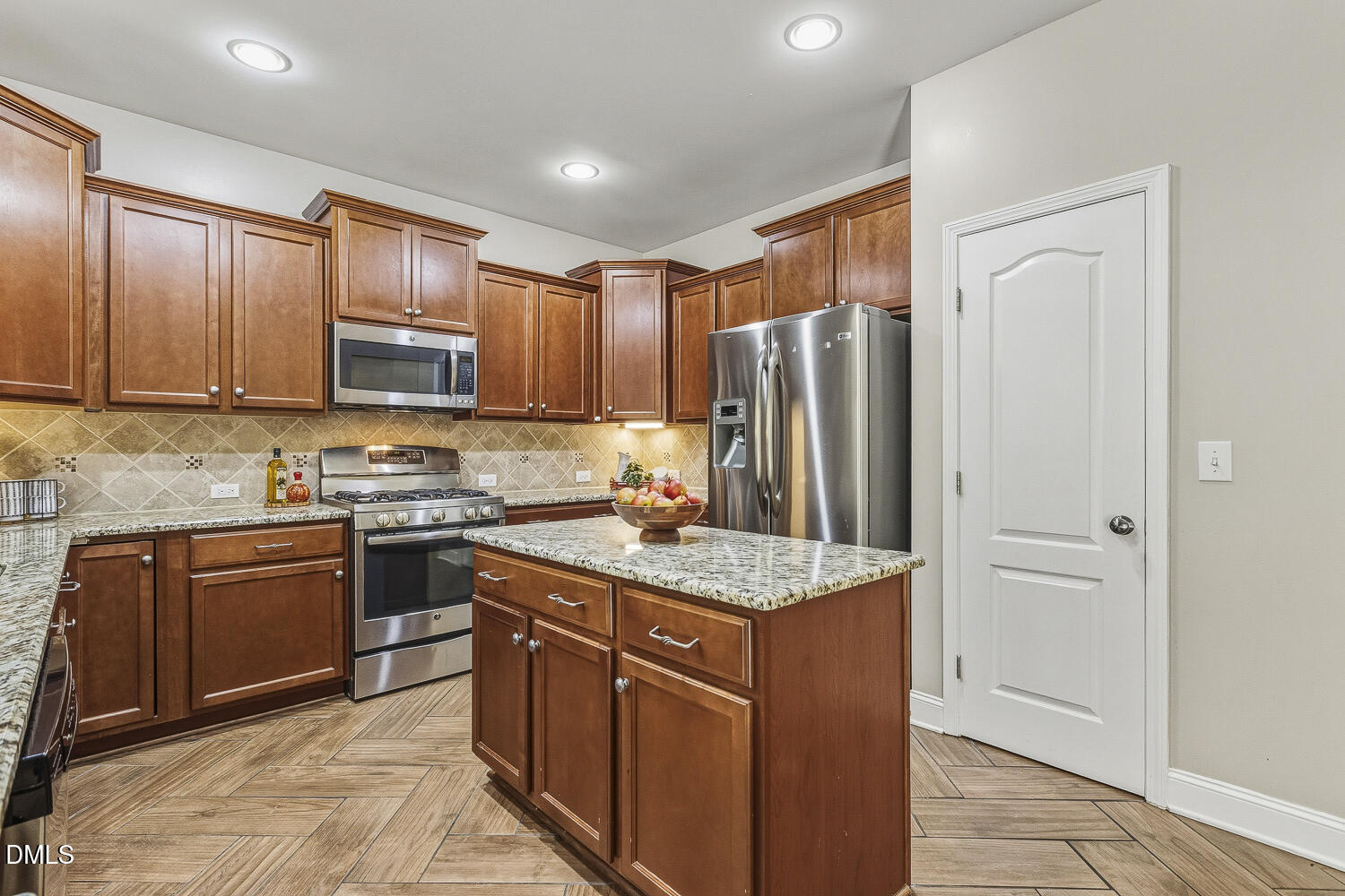 1008 Poplar Street Durham, NC 27703 - Photo 18 of 73 a kitchen with stainless steel appliances granite countertop a stove refrigerator sink and microwave
