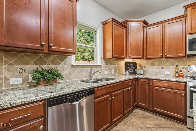 a kitchen with granite countertop cabinets sink and a granite counter top