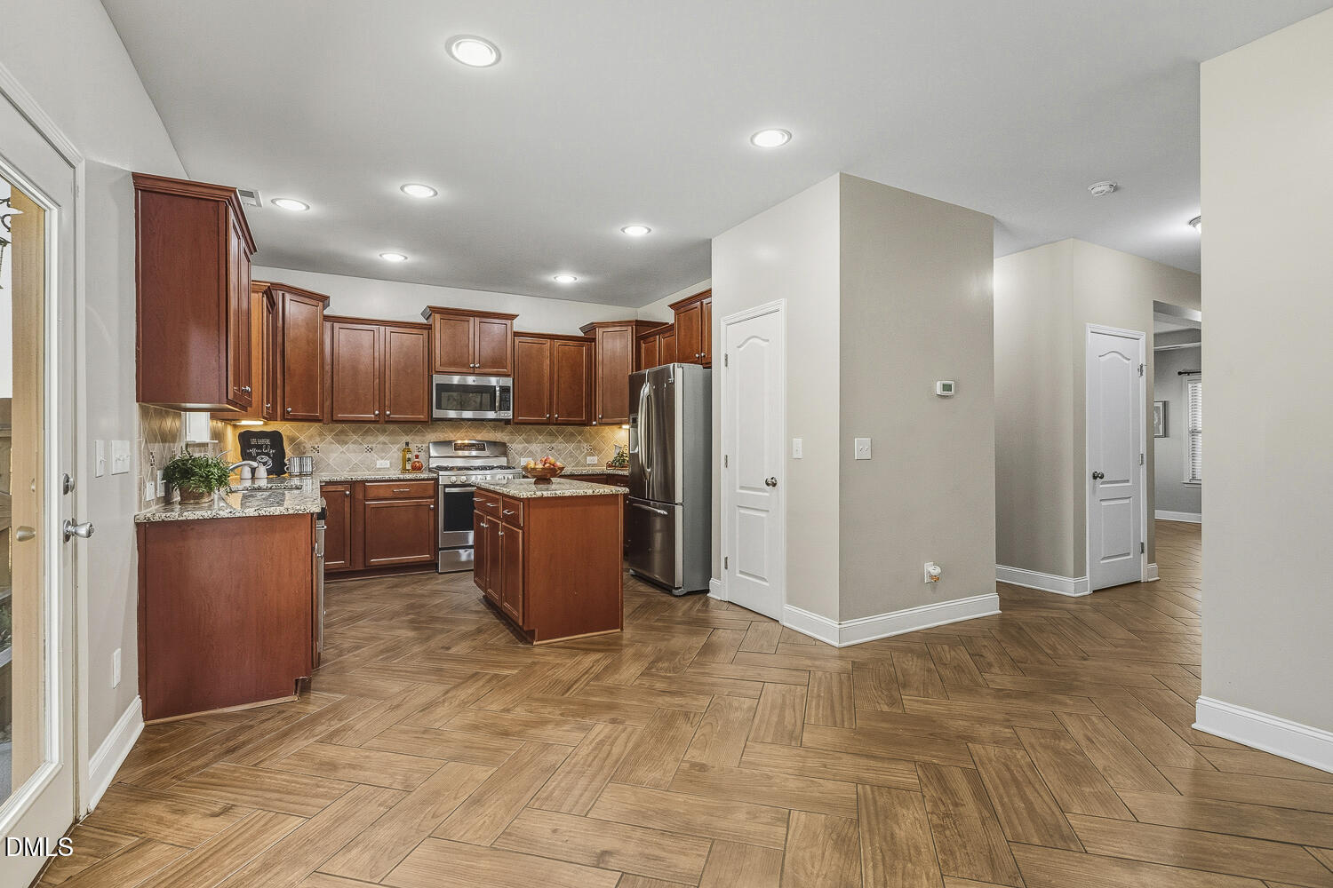 1008 Poplar Street Durham, NC 27703 - Photo 22 of 73 a view of kitchen with stainless steel appliances granite countertop a refrigerator and a sink