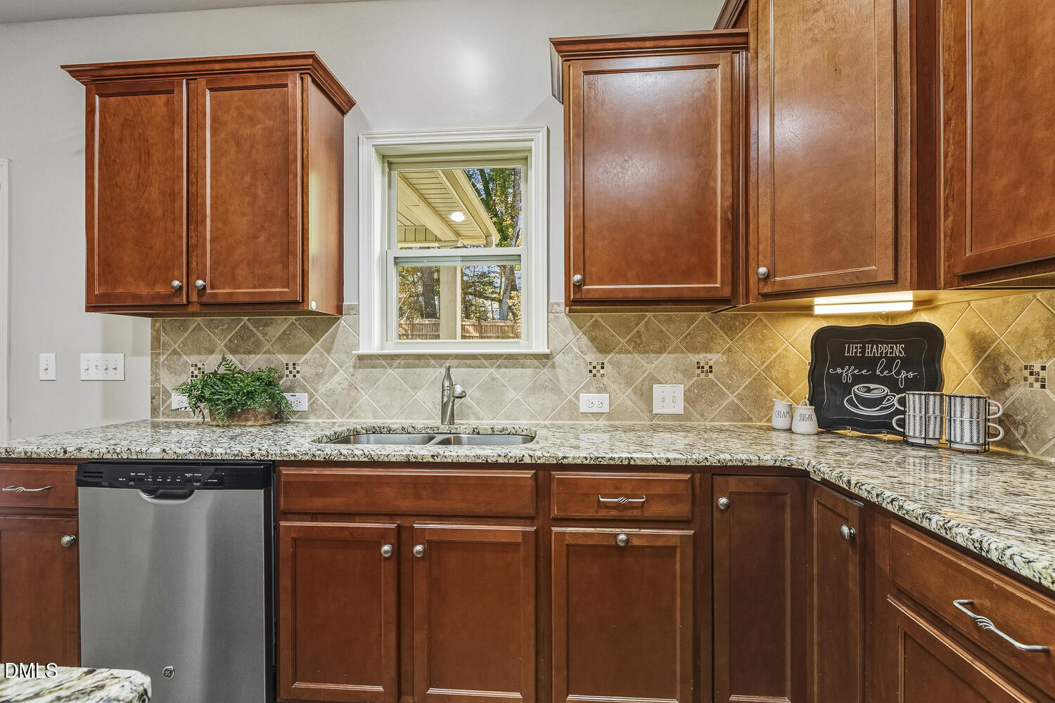 1008 Poplar Street Durham, NC 27703 - Photo 23 of 73 a kitchen with granite countertop cabinets sink and a granite counter top