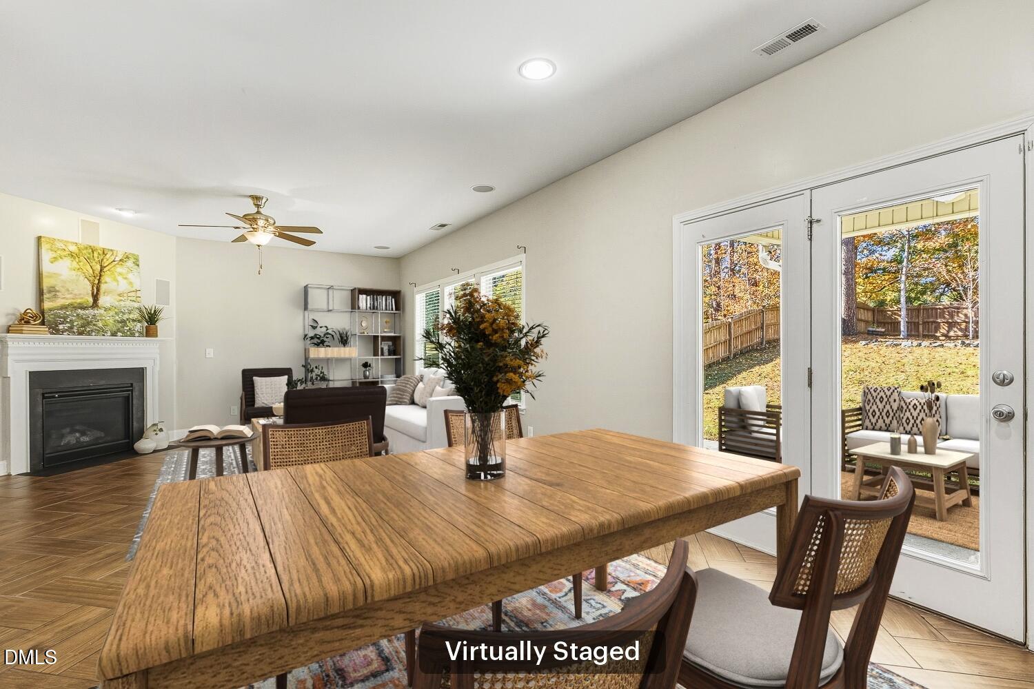 1008 Poplar Street Durham, NC 27703 - Photo 29 of 73 a dining room with furniture a fireplace and wooden floor