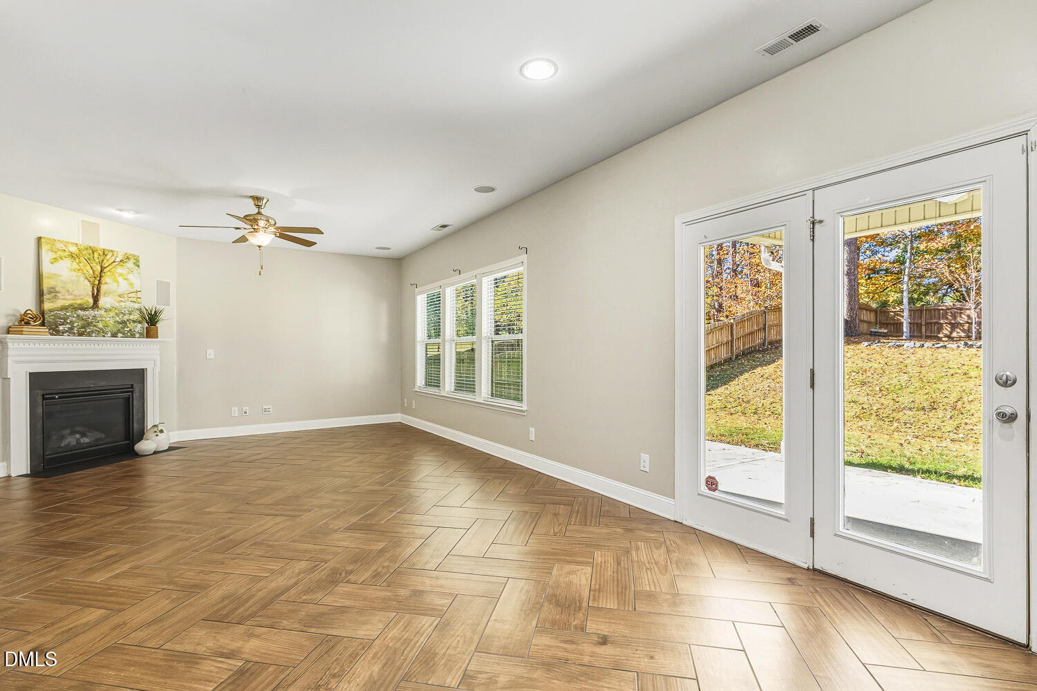 1008 Poplar Street Durham, NC 27703 - Photo 31 of 73 a view of an empty room with a fireplace and a window