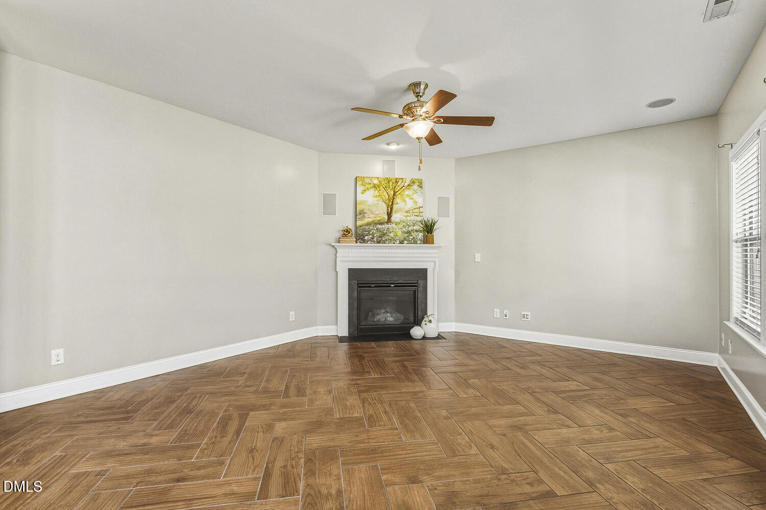1008 Poplar Street Durham, NC 27703 - Photo 32 of 73 a view of empty room with a fireplace and a fan