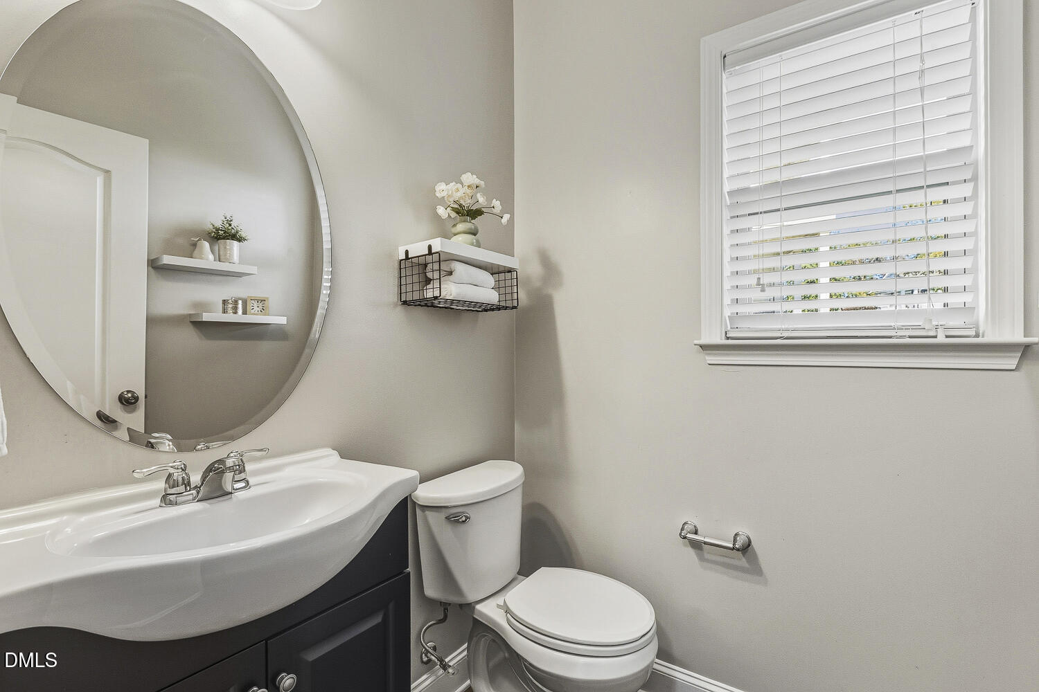 1008 Poplar Street Durham, NC 27703 - Photo 37 of 73 a bathroom with a sink a toilet and mirror