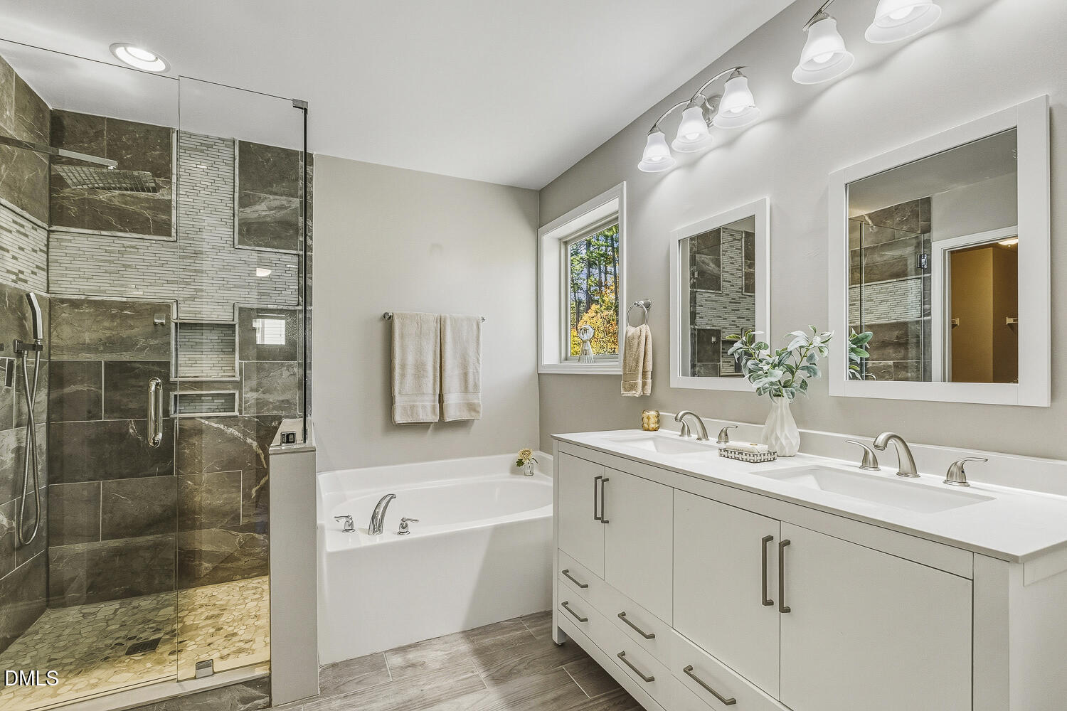 1008 Poplar Street Durham, NC 27703 - Photo 44 of 73 a bathroom with a double vanity sink mirror and shower