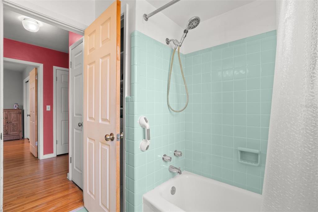 909 Woodley Road Clearwater, FL 33764 - Photo 26 of 29 a bathroom with a shower a bath tub and shower
