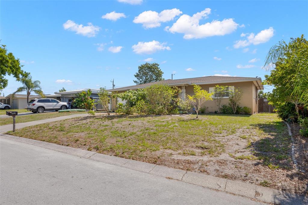 909 Woodley Road Clearwater, FL 33764 - Photo 3 of 29 a view of outdoor space and yard