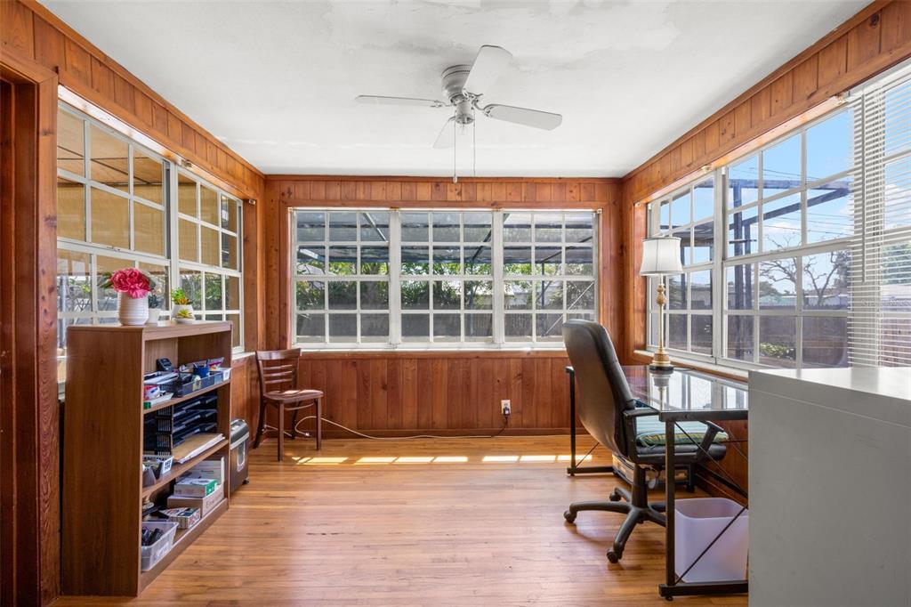 909 Woodley Road Clearwater, FL 33764 - Photo 9 of 29 a view of a workspace with furniture and a window