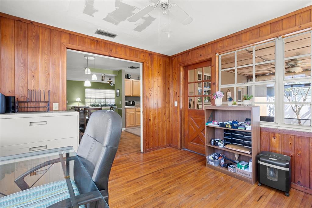 909 Woodley Road Clearwater, FL 33764 - Photo 10 of 29 a view of a dining room with furniture and wooden floor