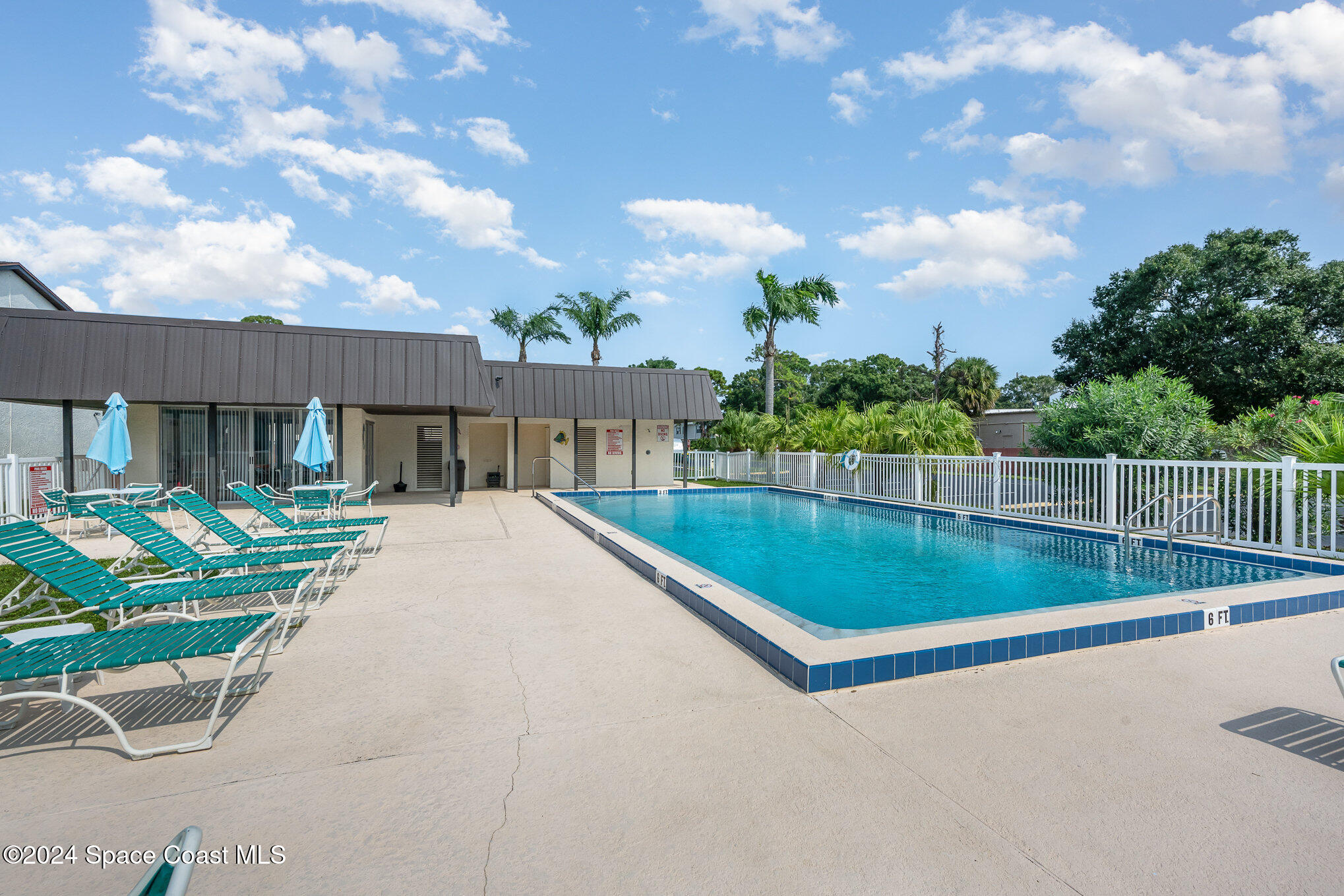 641 Ridge Club Drive, Unit 21 Melbourne, FL 32934 - Photo 23 of 23 Community Pool with Spacious Deck