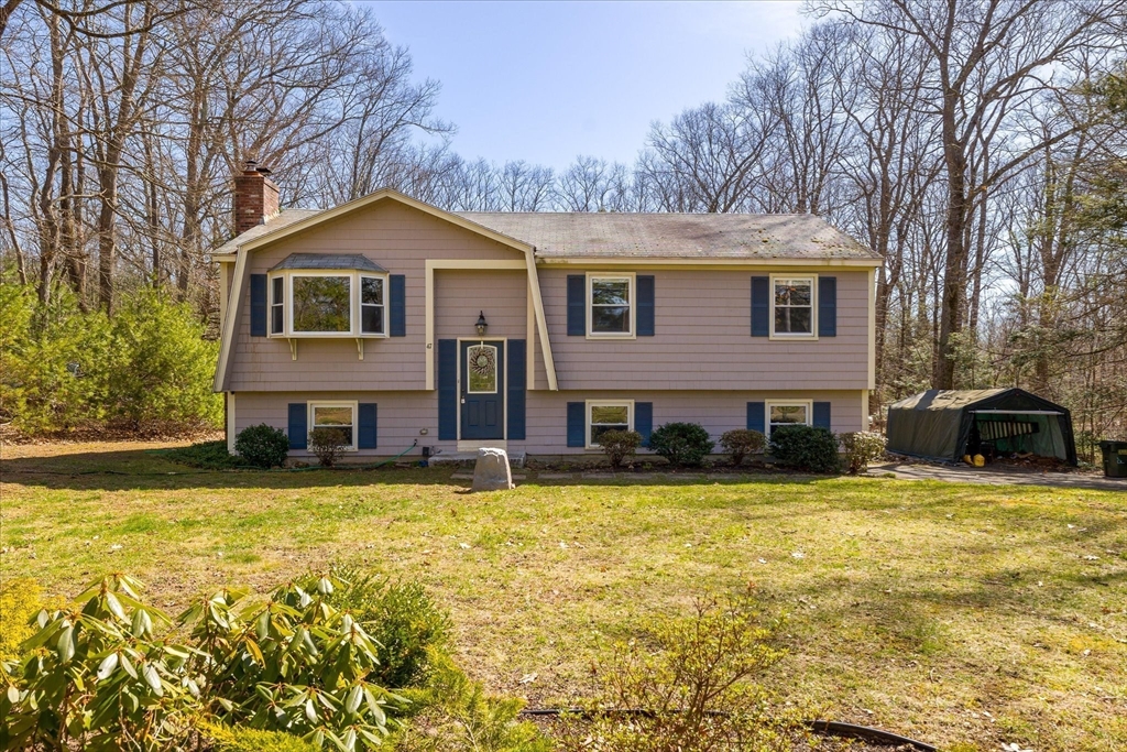 47 Shepard Road Sturbridge, MA 01566 - Photo 1 of 24 a front view of a house with yard and trees