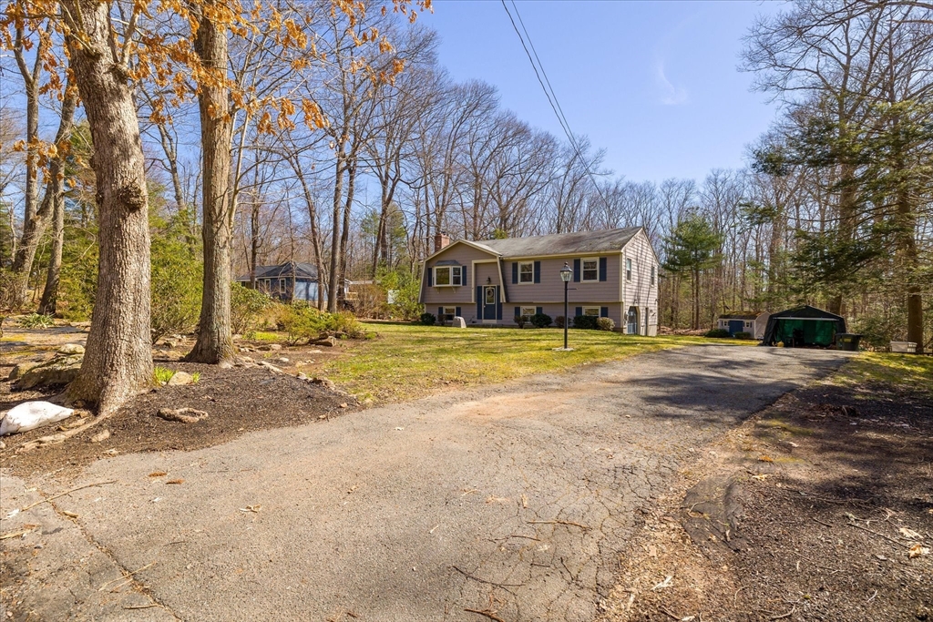 47 Shepard Road Sturbridge, MA 01566 - Photo 5 of 24 a view of a house with trees in the background