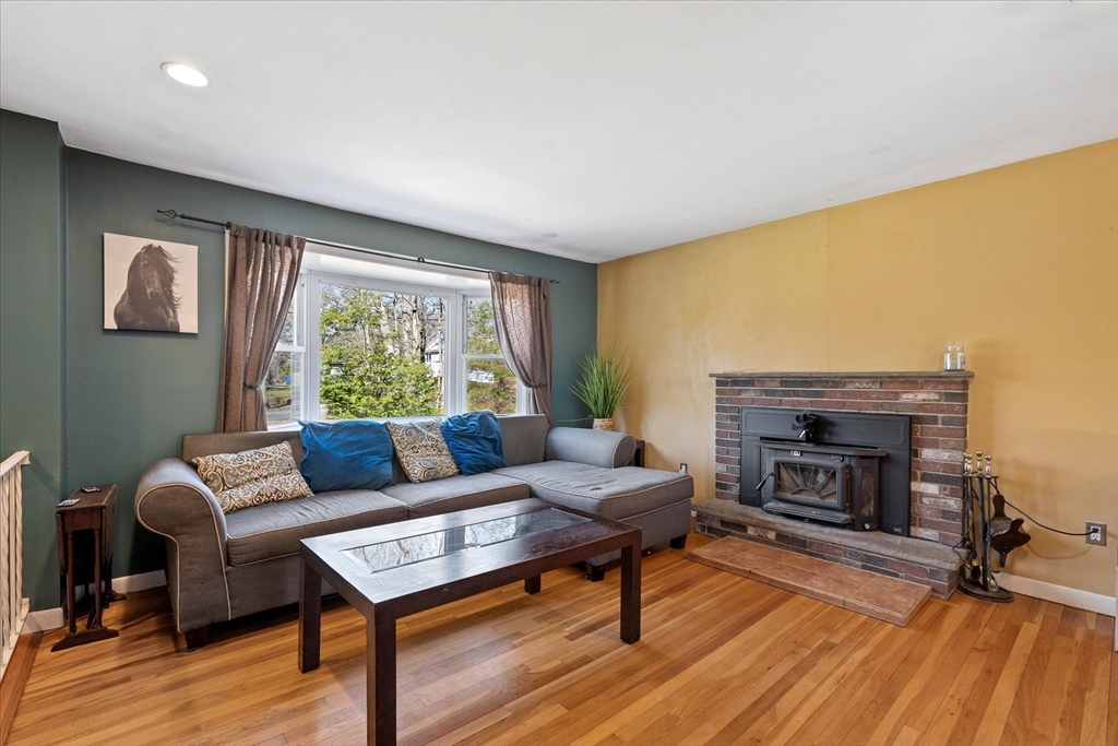 47 Shepard Road Sturbridge, MA 01566 - Photo 7 of 24 a living room with furniture and a fireplace
