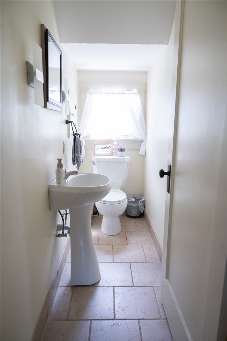 3365 Trapping Brook Road Wellsville, NY 14895 - Photo 16 of 47 A cute half bathroom with modern sconces is just what you and your guests will need.