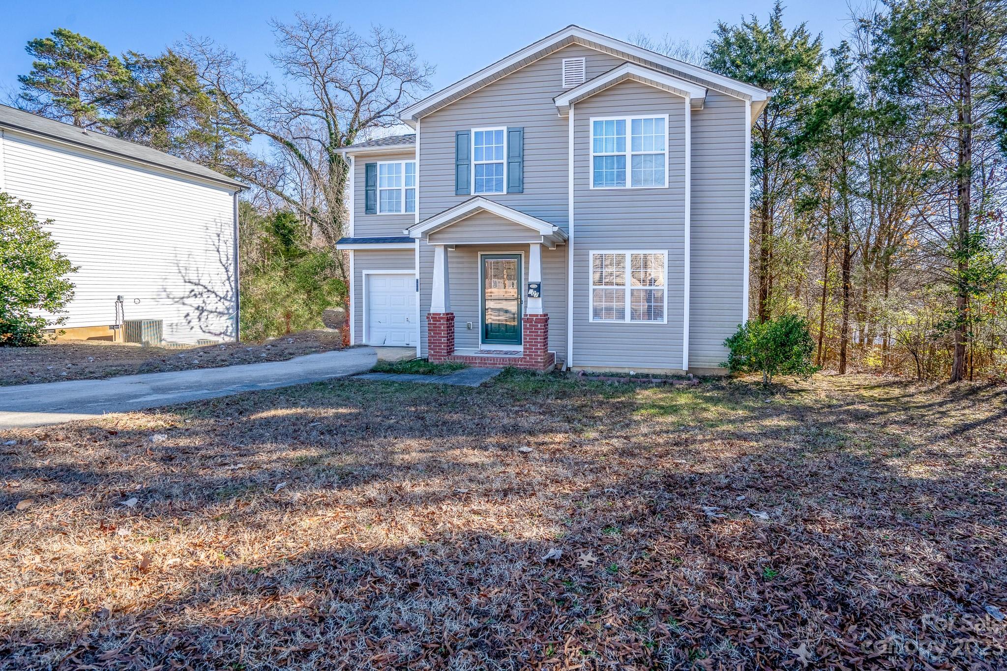 907 McDonald Road Charlotte, NC 28214 - Photo 1 of 28 a front view of a house with garden
