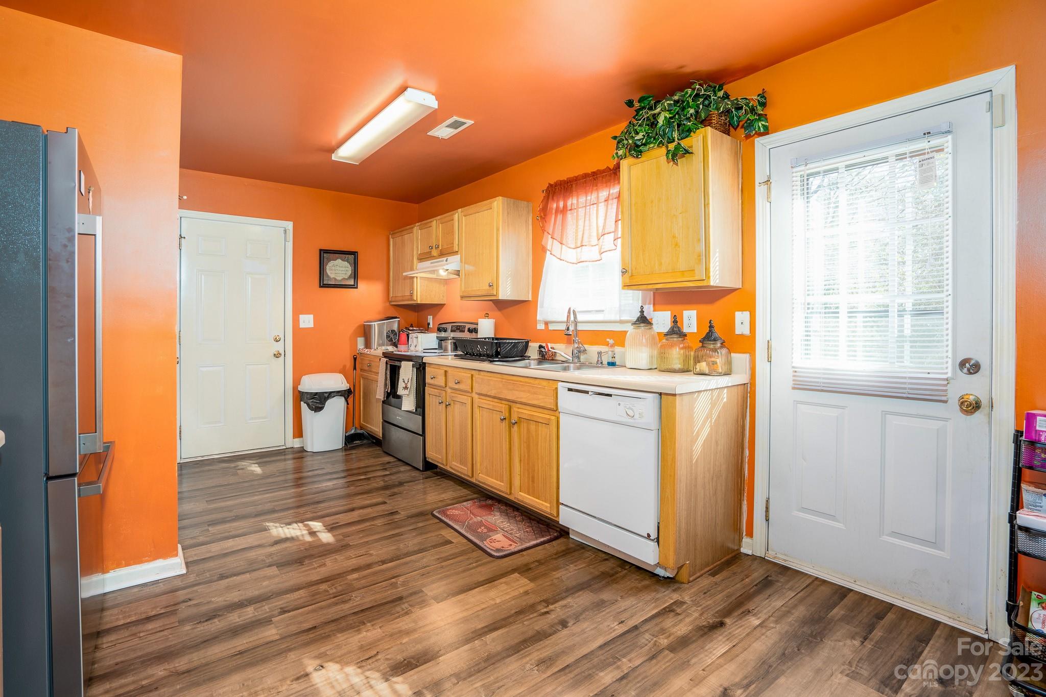 907 McDonald Road Charlotte, NC 28214 - Photo 12 of 28 a kitchen with a sink window and cabinets