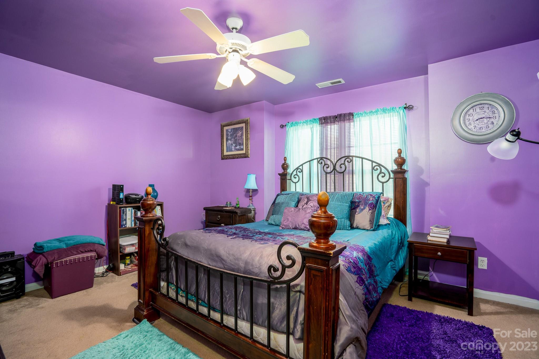 907 McDonald Road Charlotte, NC 28214 - Photo 18 of 28 a bedroom with a bed and a chandelier