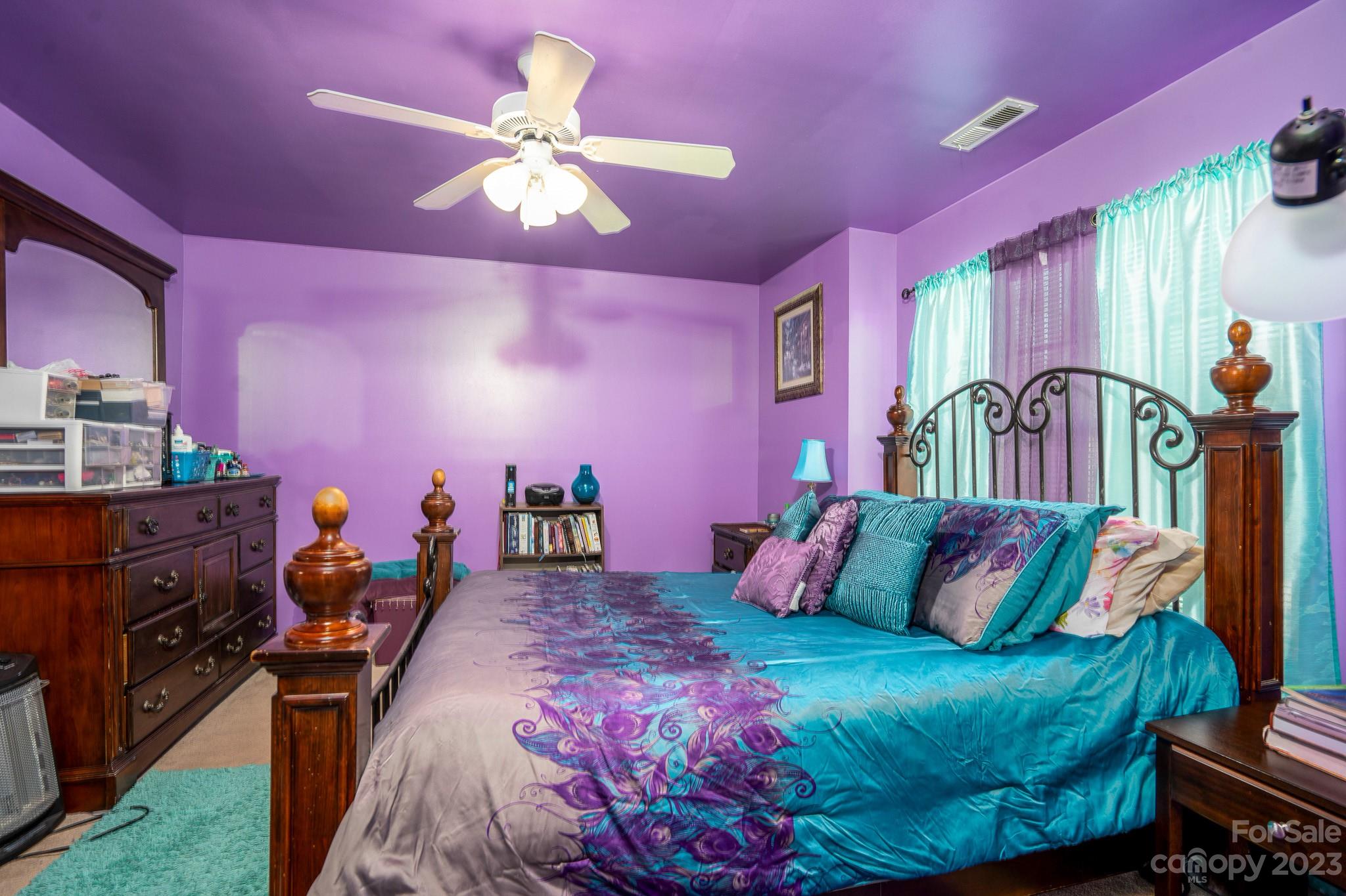 907 McDonald Road Charlotte, NC 28214 - Photo 19 of 28 a bed room with a bed and a lamp