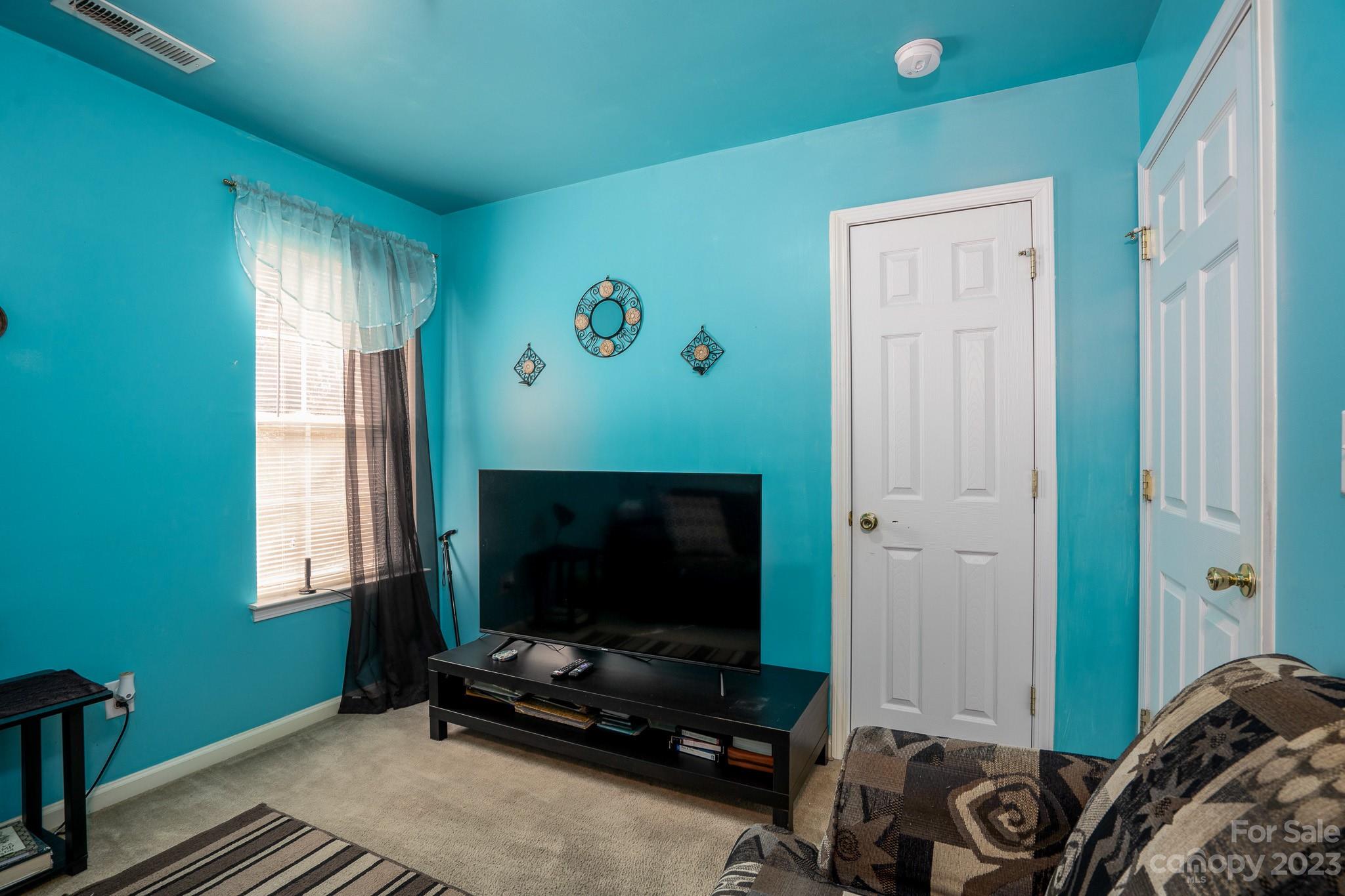 907 McDonald Road Charlotte, NC 28214 - Photo 24 of 28 a living room with furniture and a flat screen tv