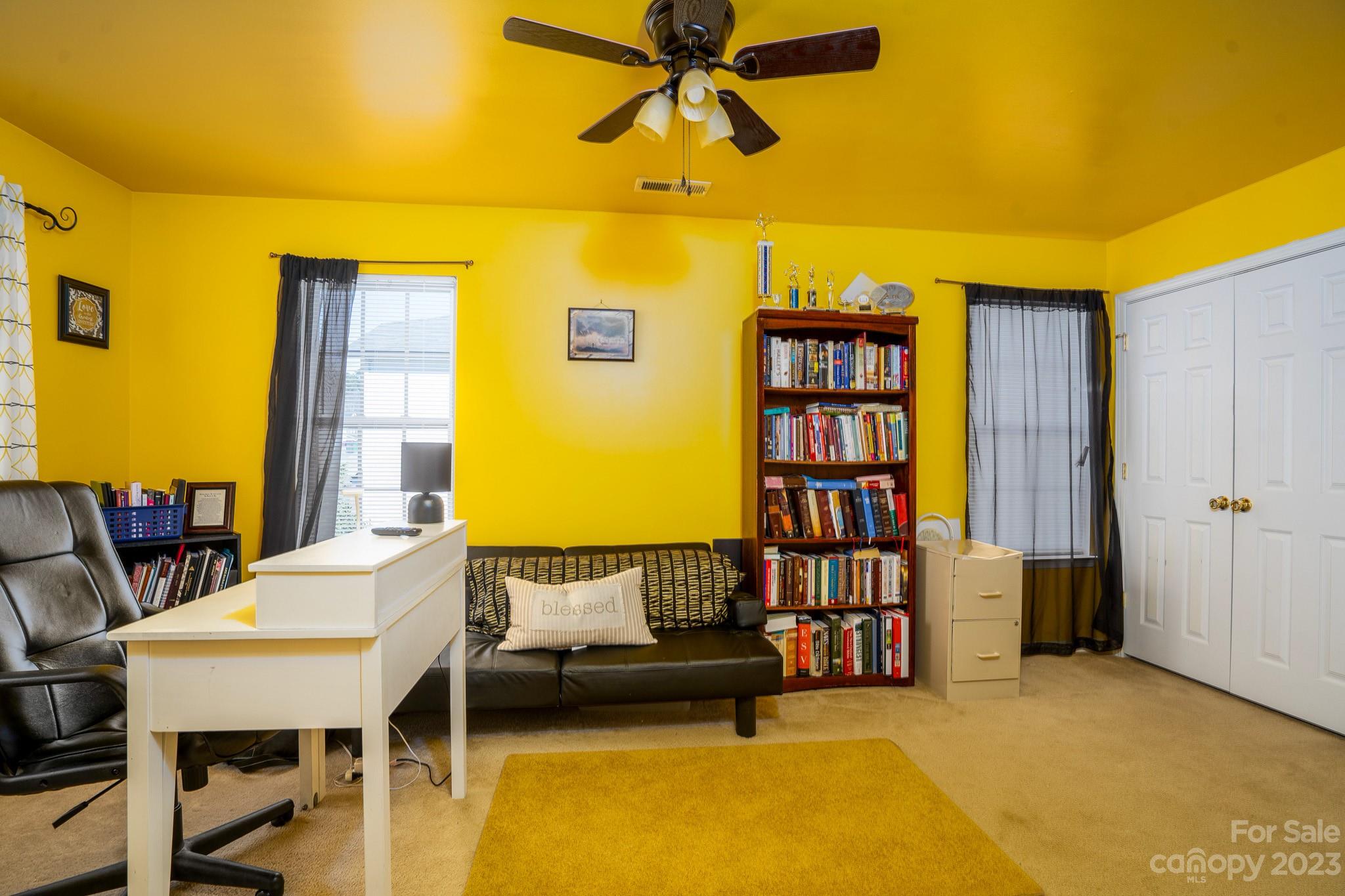 907 McDonald Road Charlotte, NC 28214 - Photo 26 of 28 a living room with furniture and a book shelf