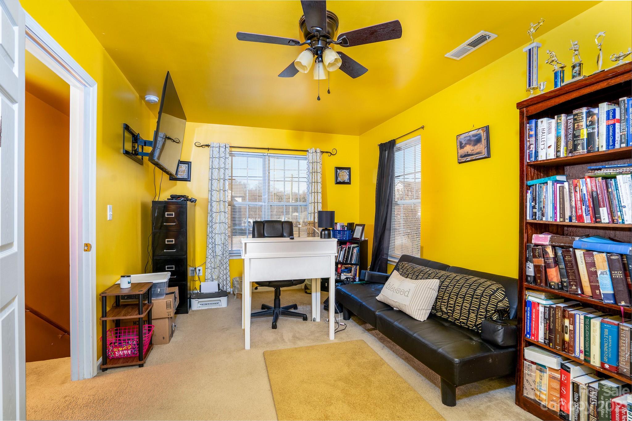 907 McDonald Road Charlotte, NC 28214 - Photo 27 of 28 a living room with furniture and a book shelf
