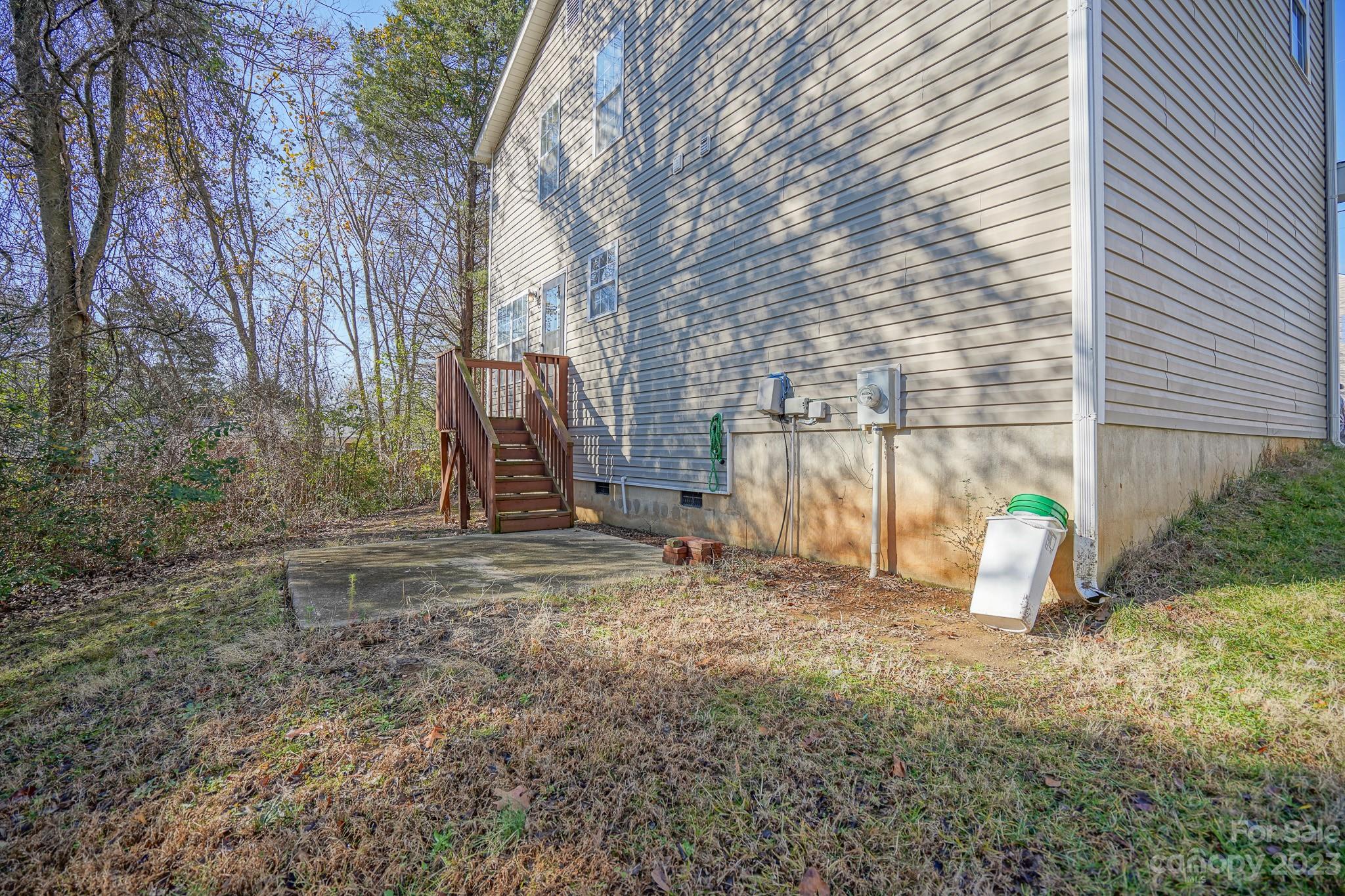 907 McDonald Road Charlotte, NC 28214 - Photo 28 of 28 a backyard of house with a slide and swing