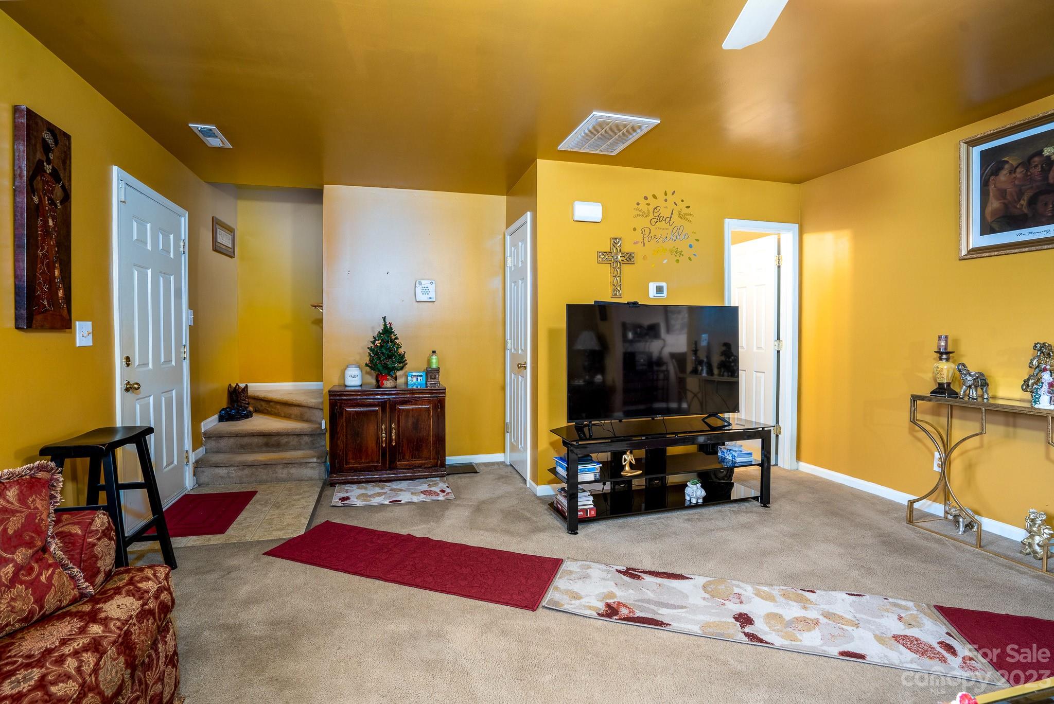 907 McDonald Road Charlotte, NC 28214 - Photo 6 of 28 a living room with furniture and a flat screen tv