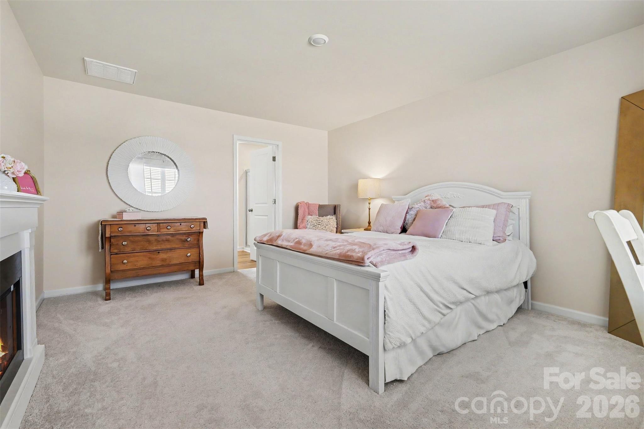 633 Mile Crk Road Edgemoor, SC 29712 - Photo 16 of 26 a bedroom with a bed and a lamp