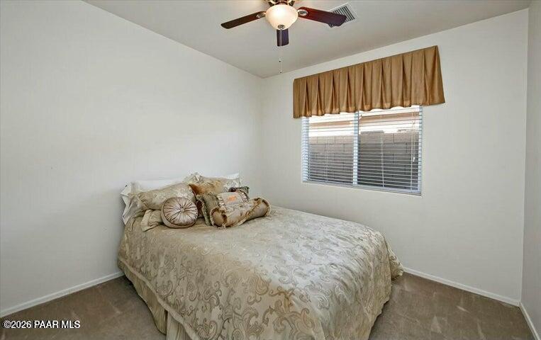 650 North Robles Street Dewey, AZ 86327 - Photo 11 of 13 a bedroom with a bed and a window