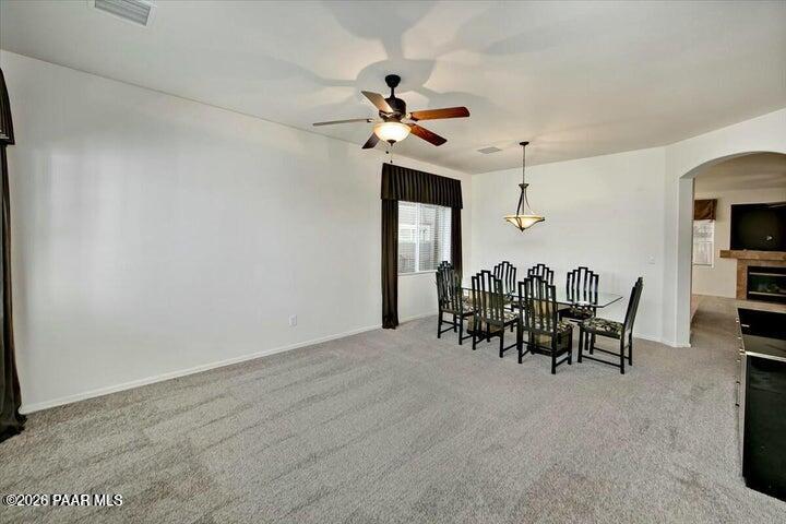 650 North Robles Street Dewey, AZ 86327 - Photo 3 of 13 a view of a dining room with furniture and chandelier fan