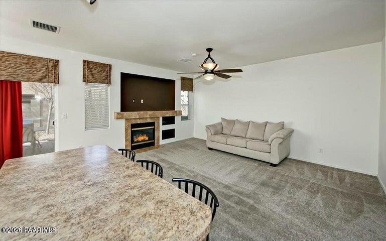 650 North Robles Street Dewey, AZ 86327 - Photo 7 of 13 a living room with furniture and a flat screen tv