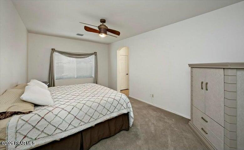 650 North Robles Street Dewey, AZ 86327 - Photo 9 of 13 a bedroom with a bed and painting on the wall