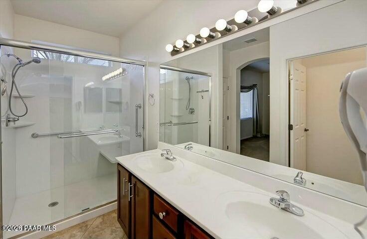 650 North Robles Street Dewey, AZ 86327 - Photo 10 of 13 a bathroom with a sink vanity granite shower and a mirror