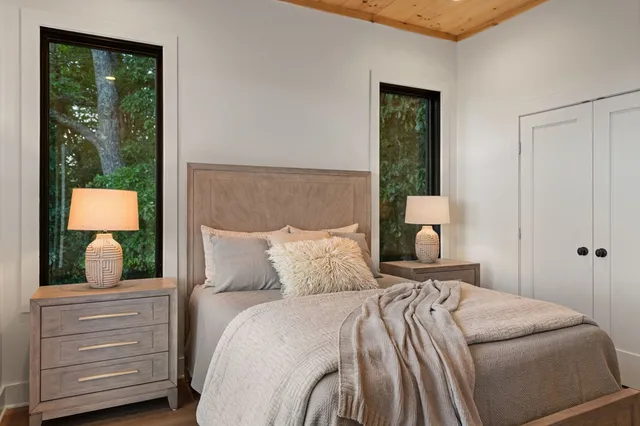 a bed room with a bed and a lamp