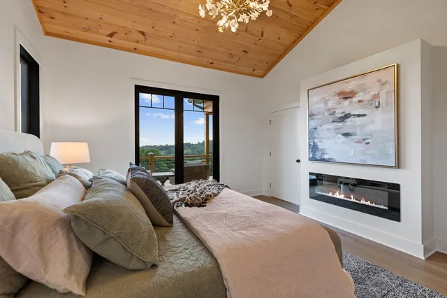 a kitchen with a wooden floor and a window