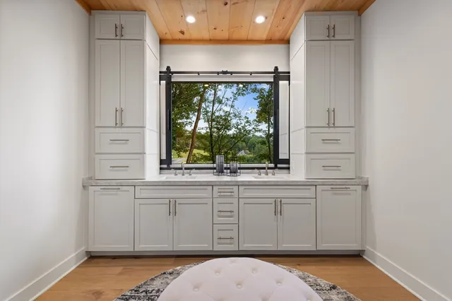 a bathroom with a glass shower door