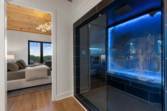 a living room with furniture a couch and a floor to ceiling window