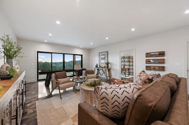 a living room with a couch and a window