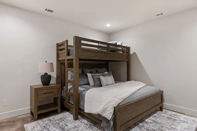 a living room with a couch and a lamp