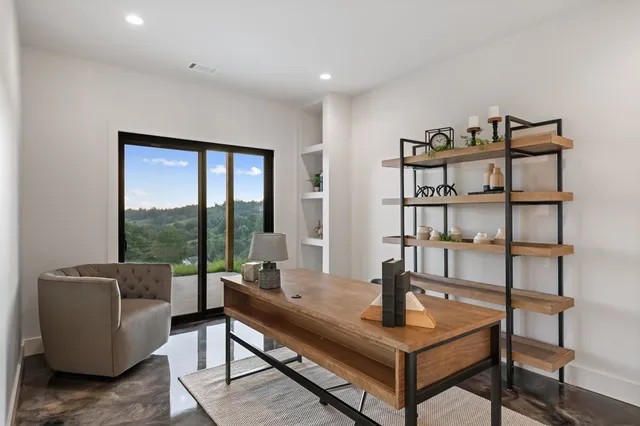 a view of roof deck with mountain view and wooden floor