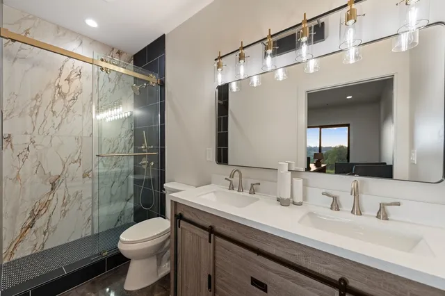 a view of a balcony with chairs and wooden floor