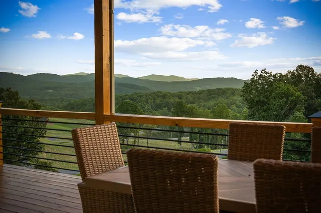 a view of a house with a yard and plants