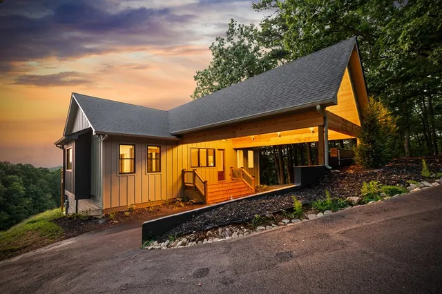 a view of an mountain range with lush green forest