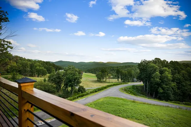 a kitchen with stainless steel appliances a stove a sink and a refrigerator