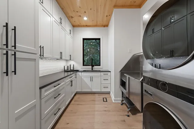 a kitchen with stainless steel appliances granite countertop a stove a refrigerator and a stove