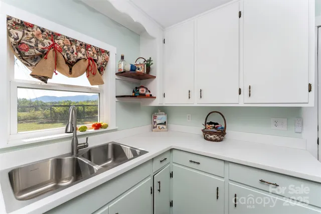 a kitchen with a refrigerator and cabinets