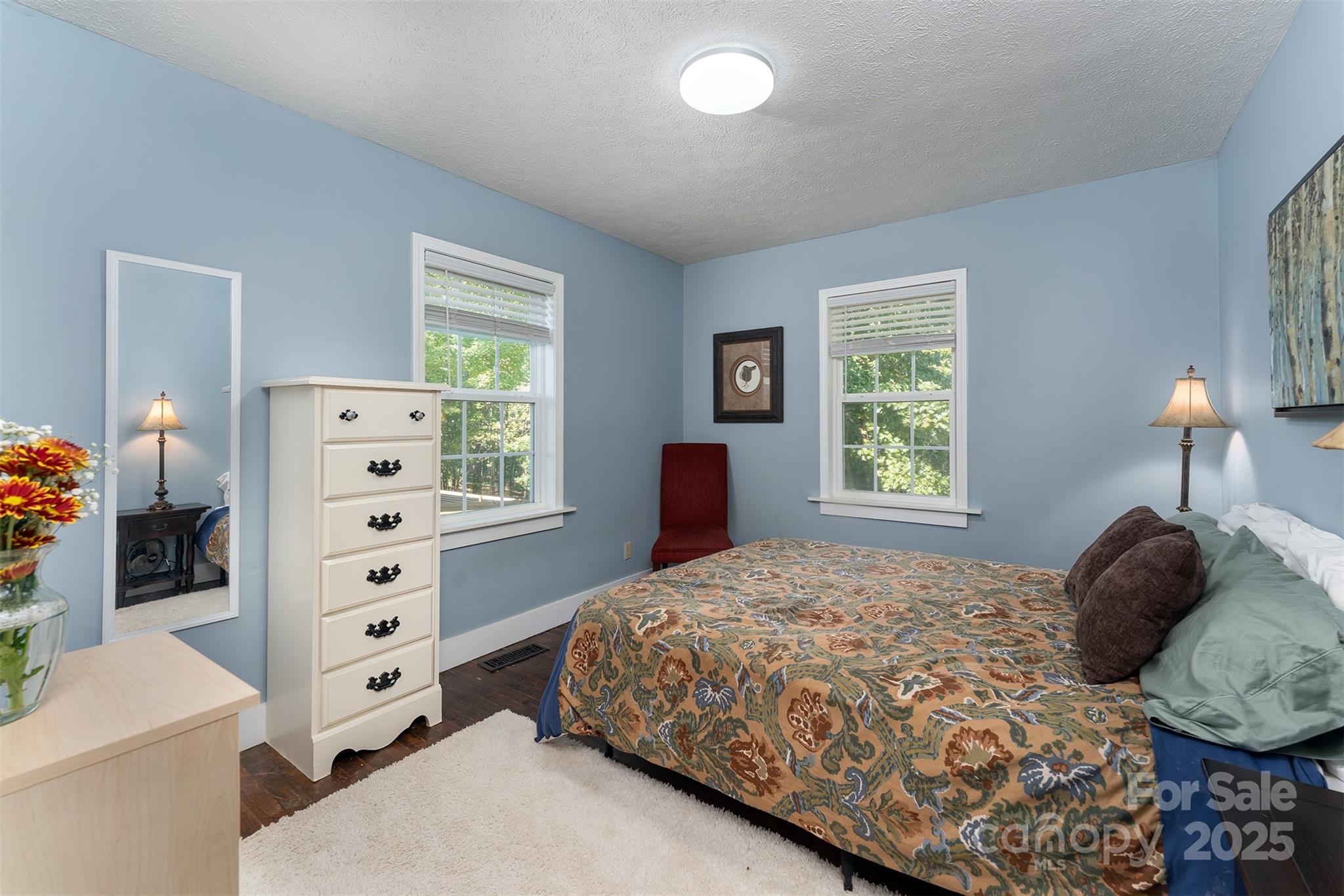1434 Lake Adger Road Mill Spring, NC 28756 - Photo 13 of 48 a bedroom with a bed and a window